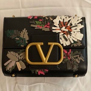 Valentino shoulder bag with VLogo and iconic maxi studs chain shoulder strap